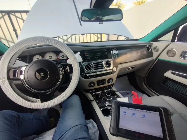 Diagnostic tablet connected inside a Rolls-Royce cabin